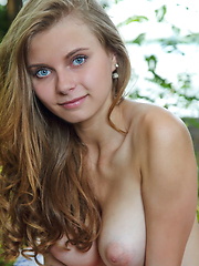 Yuki strips outdoors baring her beautiful tits and smooth pussy.