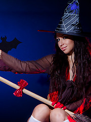Amazing long haired witch in a hat and white socks showing shaved quim and fantastic butt.