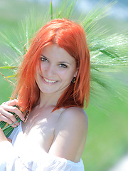 Surrounded by vast green grass, Violla's alluring beauty and charmingg allure stands out, with her pale smooth skin, fiery red hair, pink, perky boobs, and delectable labia.