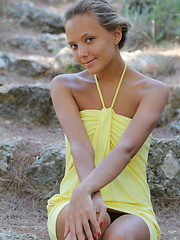 With her charming, youthful allure, tanned complexion, beautiful firm breasts with puffy nipples, Mango's natural beauty stands out on a rocky location.