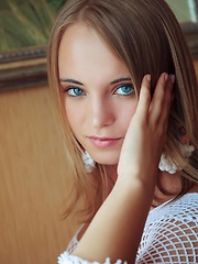 With her bright blue eyes sparkling like two precious gems and pearly white smile, Rachel looks exquisite in a white fishnet top and matching panties that accentuates her gorgeous body curves perfectly.