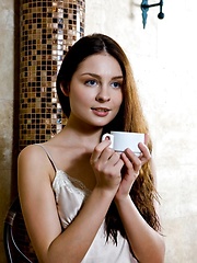 Guerlain hastily takes off all of her clothes and allow us an unobstructed view of her delectable unshaven labia and round, cuppable breasts with a warm, engaging smile.