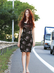 Cute long haired bombshell undressing and demonstrating naughty quim outdoor in the field.