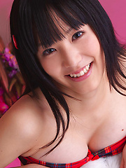 Yuri Hamada Asian in shorts and with big cans plays with balloon