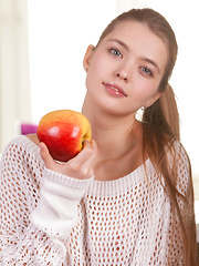 Like the sweet apple she's holding, Sigrid spreads her legs wide open to offer a view of her ripe and luscious pussy.
