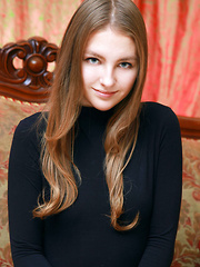 Izabel A poses so naturally on the elegant sofa showcasing her innocent and cute face, and youthful, delectable body.