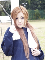 Long haired An Umemiya poses outdoor on field