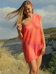Gorgeous teen embraces the summer with stripping off her clothes in front of beautiful scenery where she can feel free.